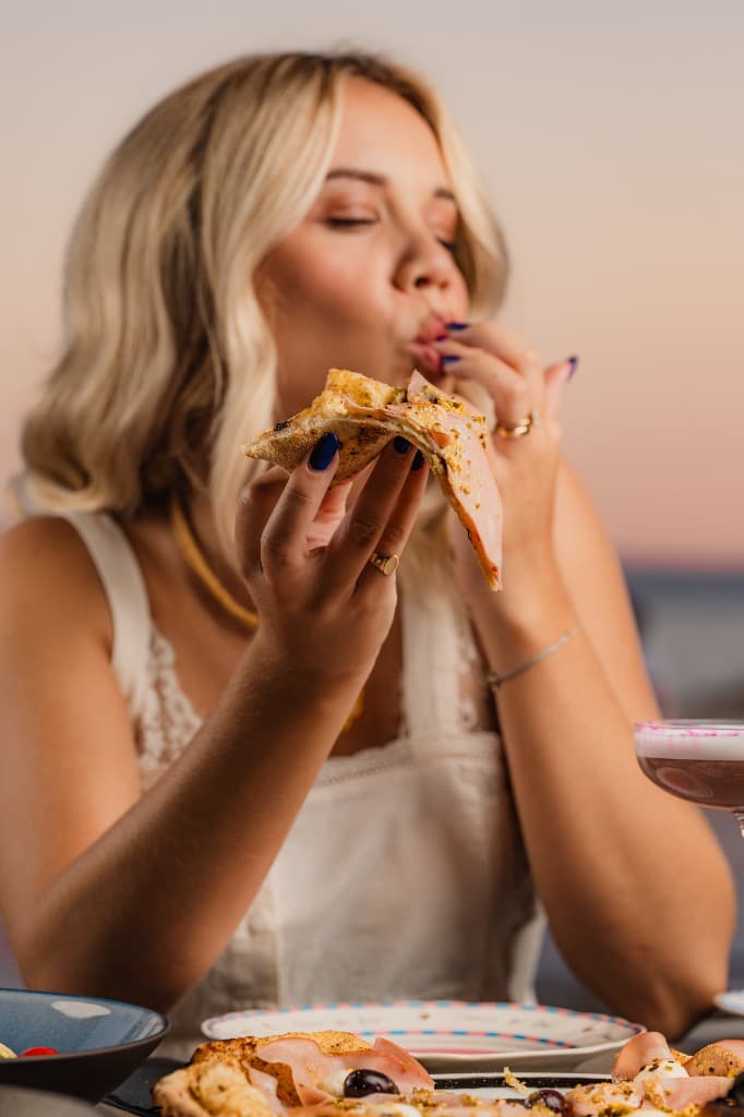 Enjoying wood-fired pizza at sunset on Žnjan beach