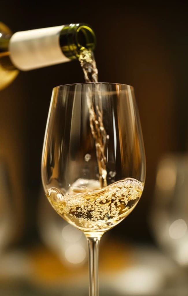 Pouring a glass of chilled white wine at Central Beach Split