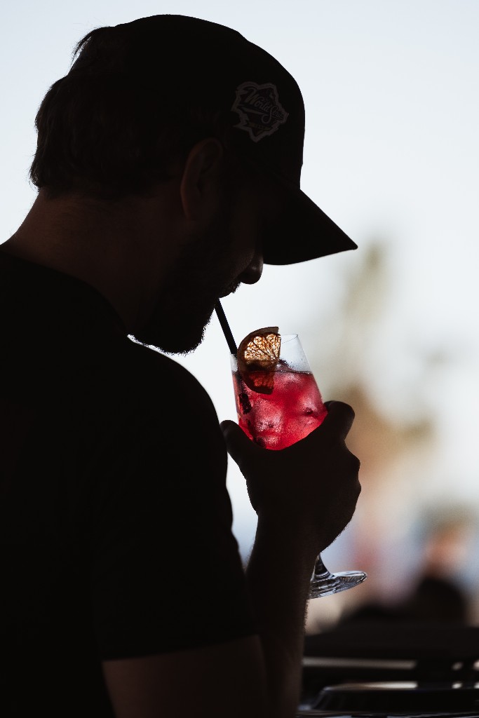 Guest sipping a cocktail at sunset, Central Beach Split