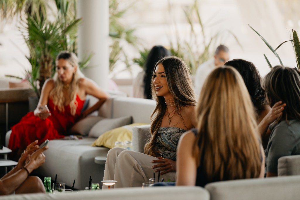 Friends chatting in the daytime lounge at Central Beach Split