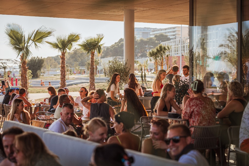 Packed terrace at golden hour, Central Beach Split, Žnjan
