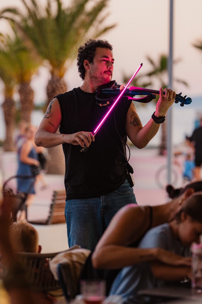 Live violinist on the promenade at Central Beach Split