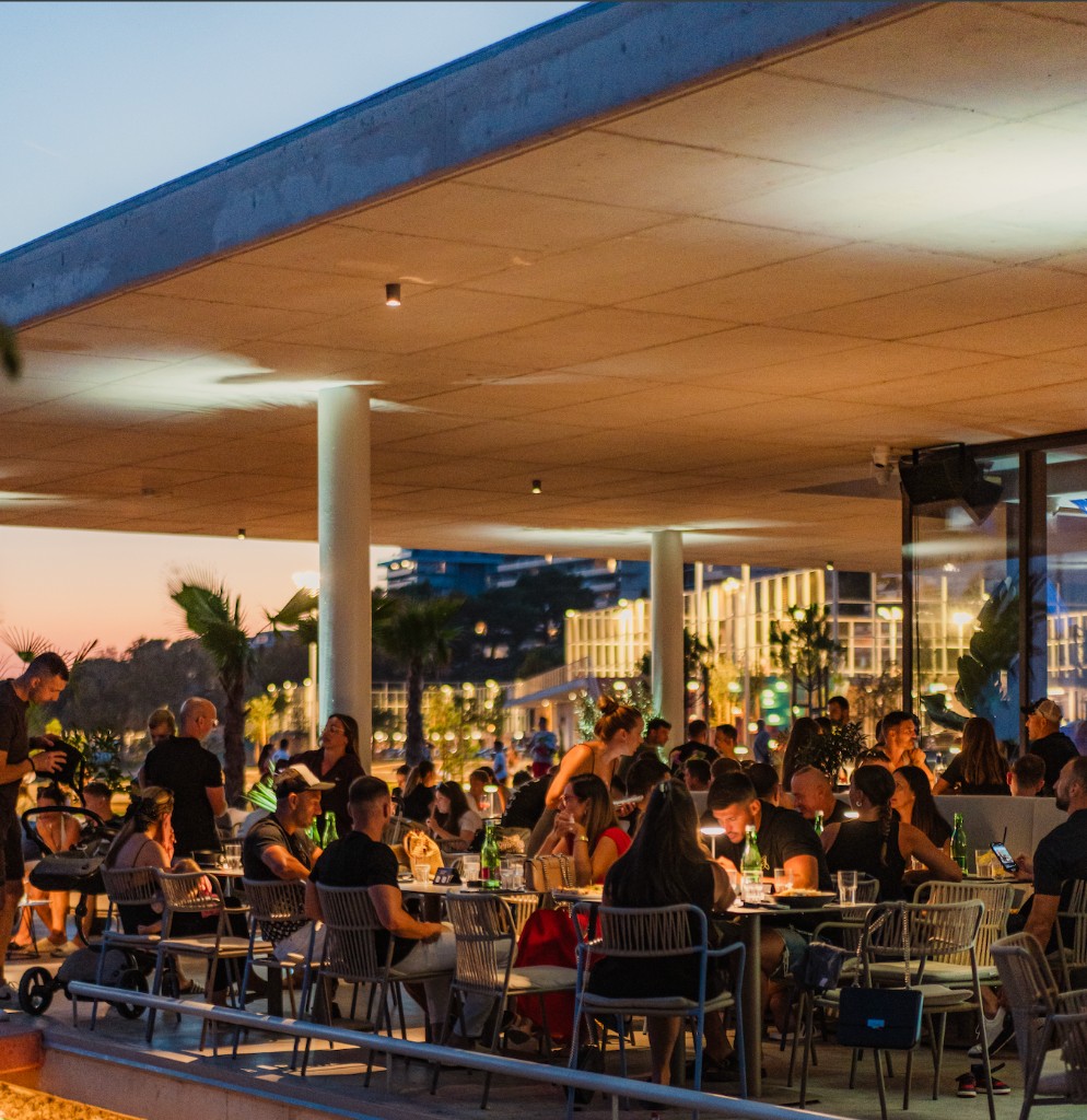Terrace full of guests at dusk, Central Beach Split, Žnjan